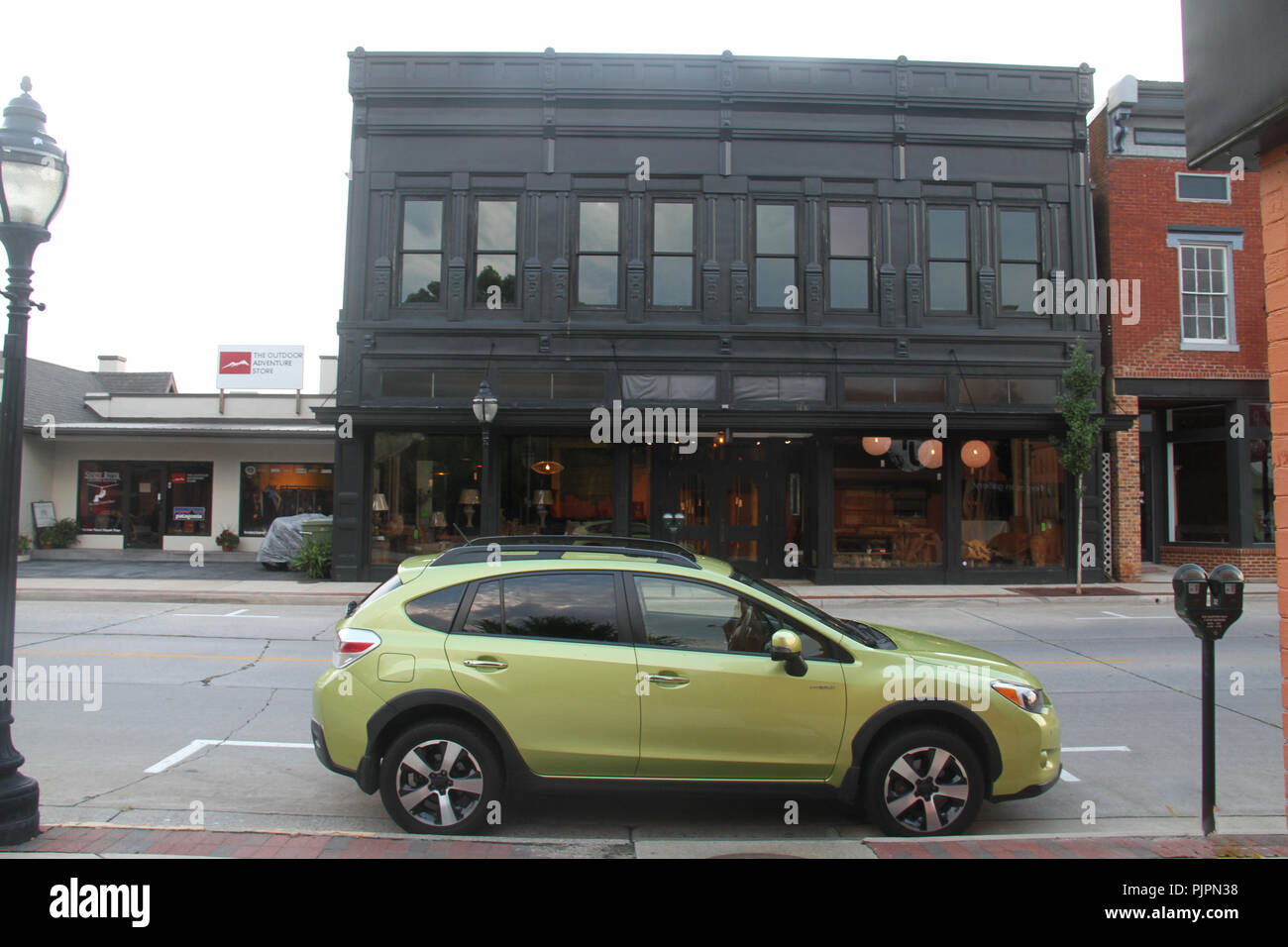 Car parked on the curb on Main Street in downtown Farmville, VA, USA