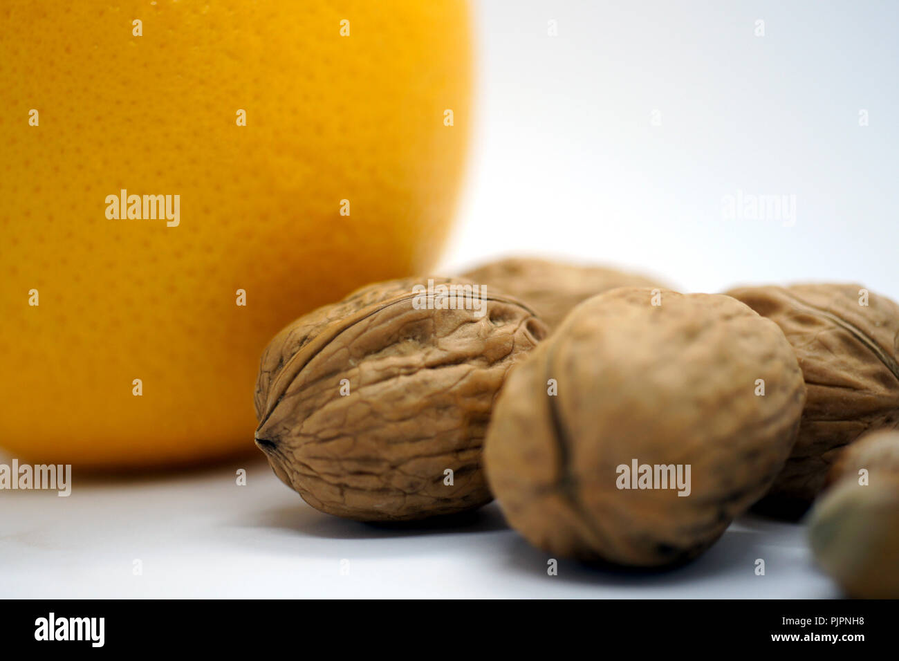 walnuts hazelnuts and orange Stock Photo
