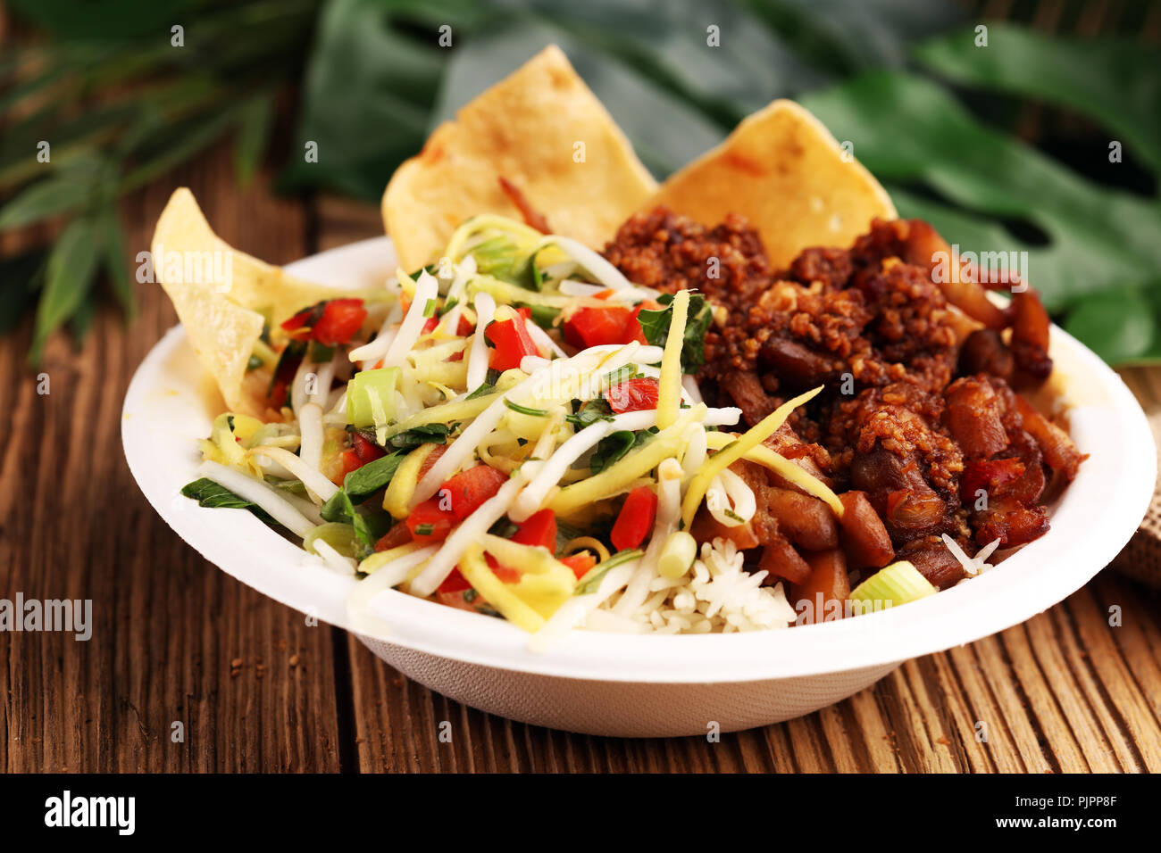 Nasi Campur Bali. Popular Balinese meal of rice with meat. Typical Malaysian street food lunch mixed rice Stock Photo