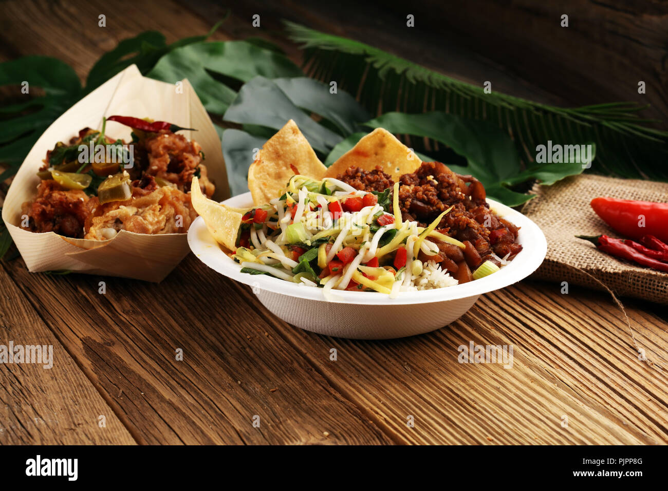 Nasi Campur Bali. Popular Balinese meal of rice with meat. Typical Malaysian street food lunch mixed rice Stock Photo
