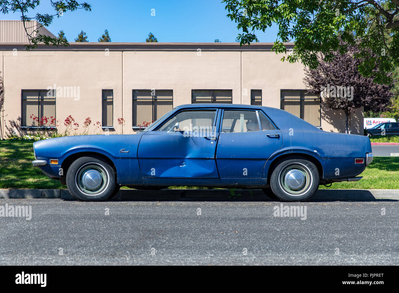 Battered blue Mercury Comet, car, parked on street; Sunnyvale, California, USA Stock Photo