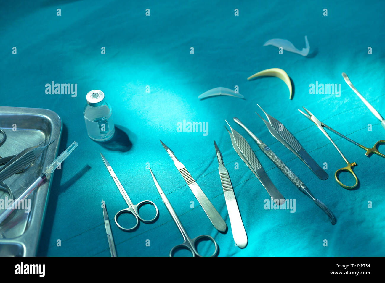 Surgical instruments, silicone nasal implant and silicone chin implants in operating room. Stock Photo