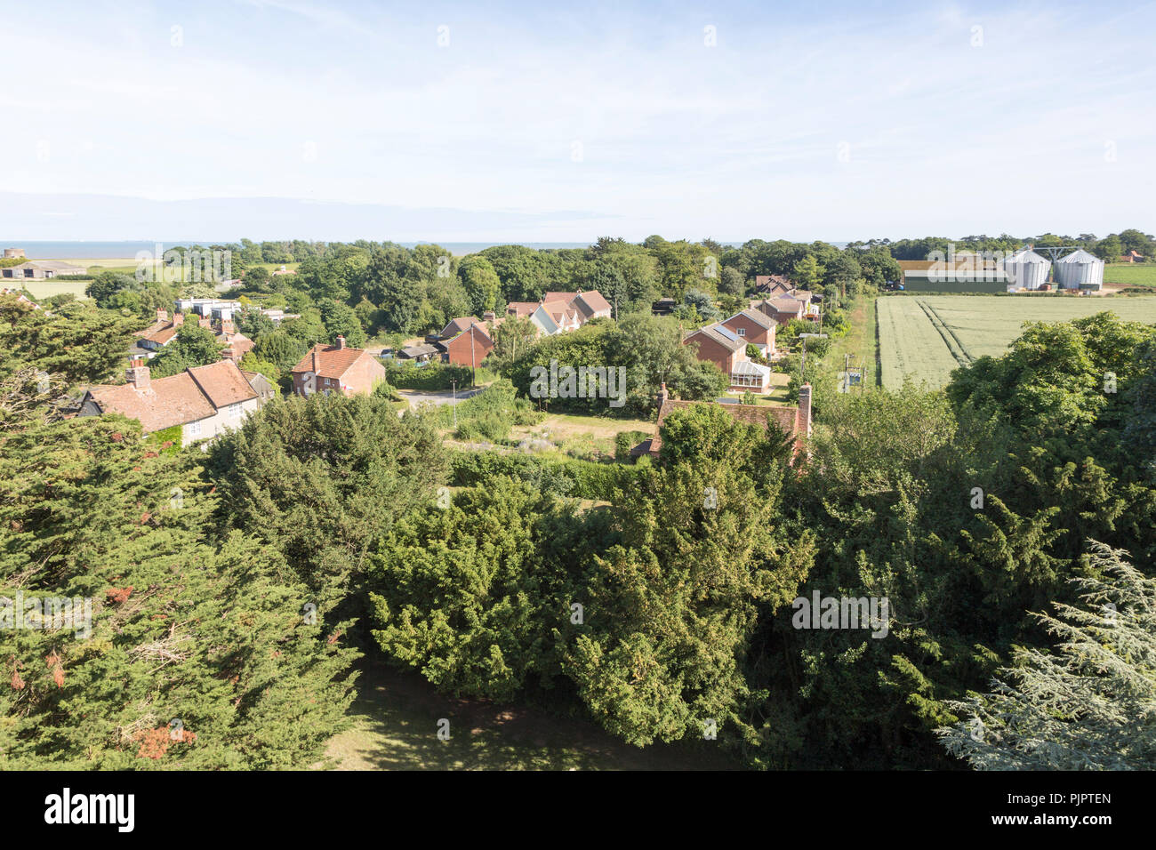 North Sea village landscape over trees in summer at Bawdsey, Suffolk, England, UK view from church tower Stock Photo