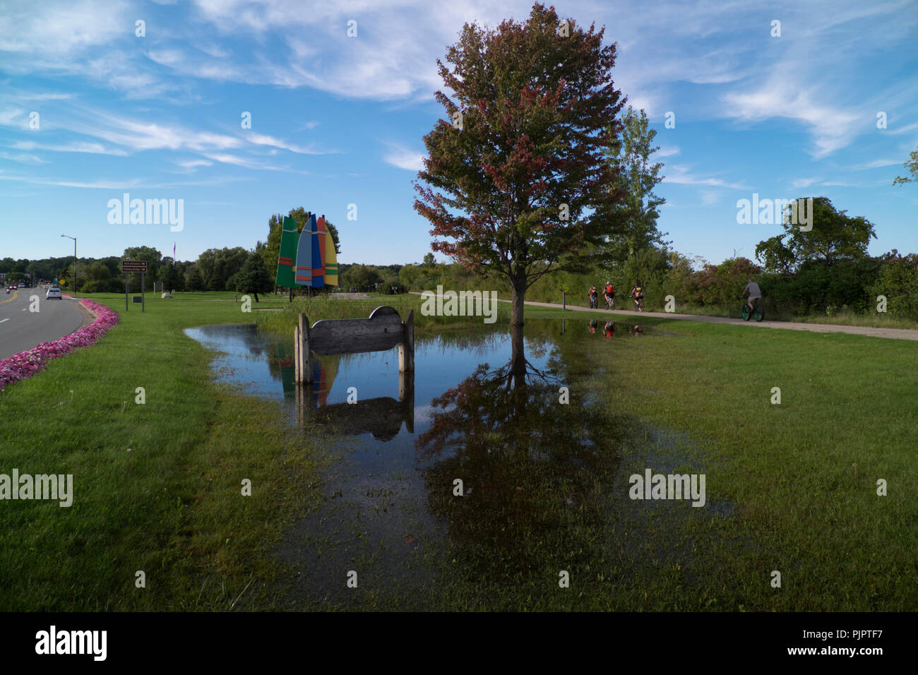 People bicycling on the HartMontague State Park bicyle trail through