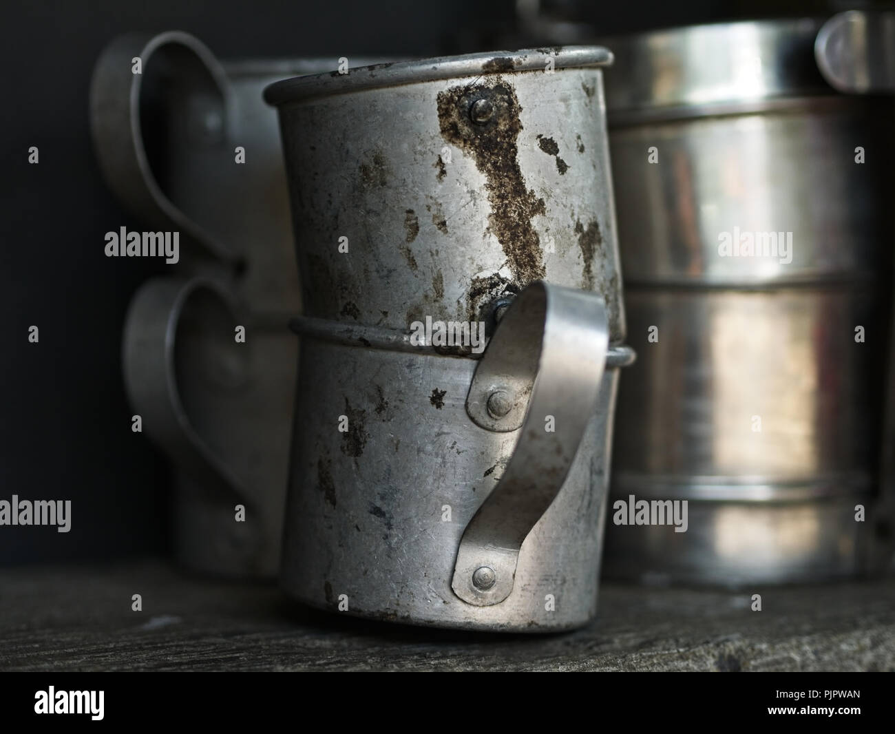 Antique aluminium mugs with handle. Concept of camping, exploration,  adventure or nostalgia Stock Photo - Alamy