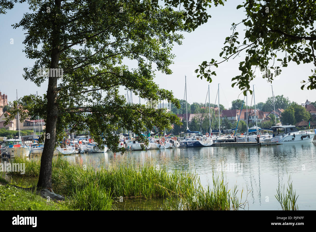 RYN, WARMIA-MASURIA PROVINCE / POLAND - JULY 31, 2018: Marina and pier on Rynskie lake, town of Ryn. Stock Photo