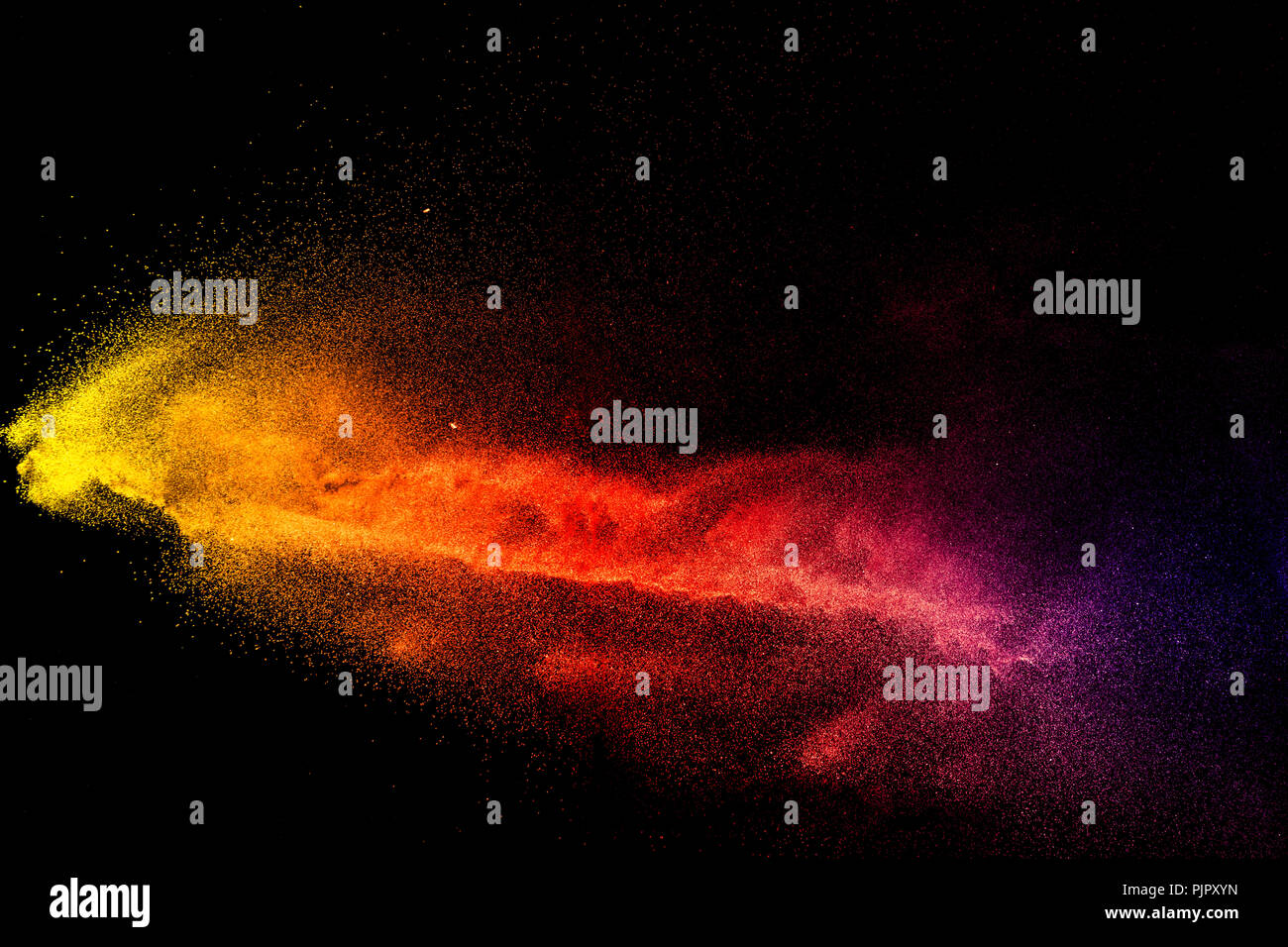 Freeze motion of color dust particles on black background.Abstract color powder overlay texture ...