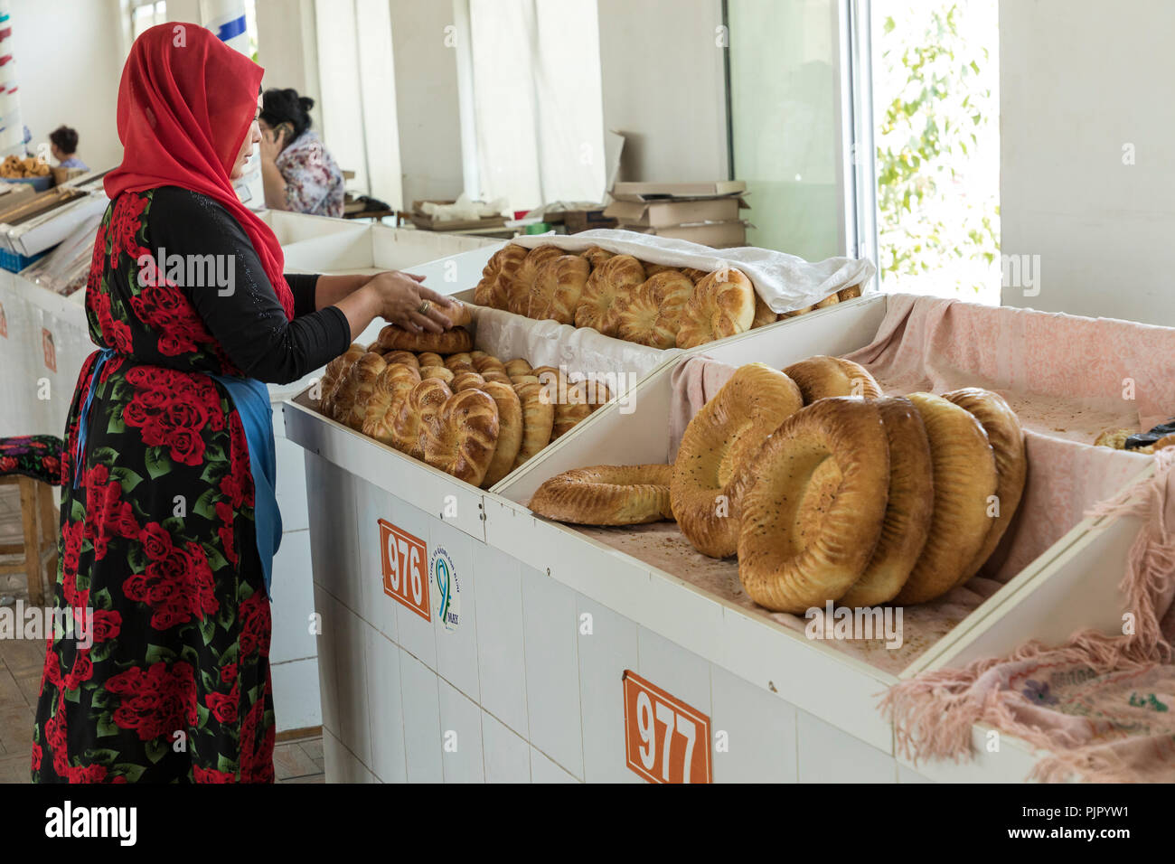 TASHKENT UZBEKISTAN - AUGUST 22 2018: National plain uzbek bread sold in the market - Tashkent, Uzbekistan. Stock Photo