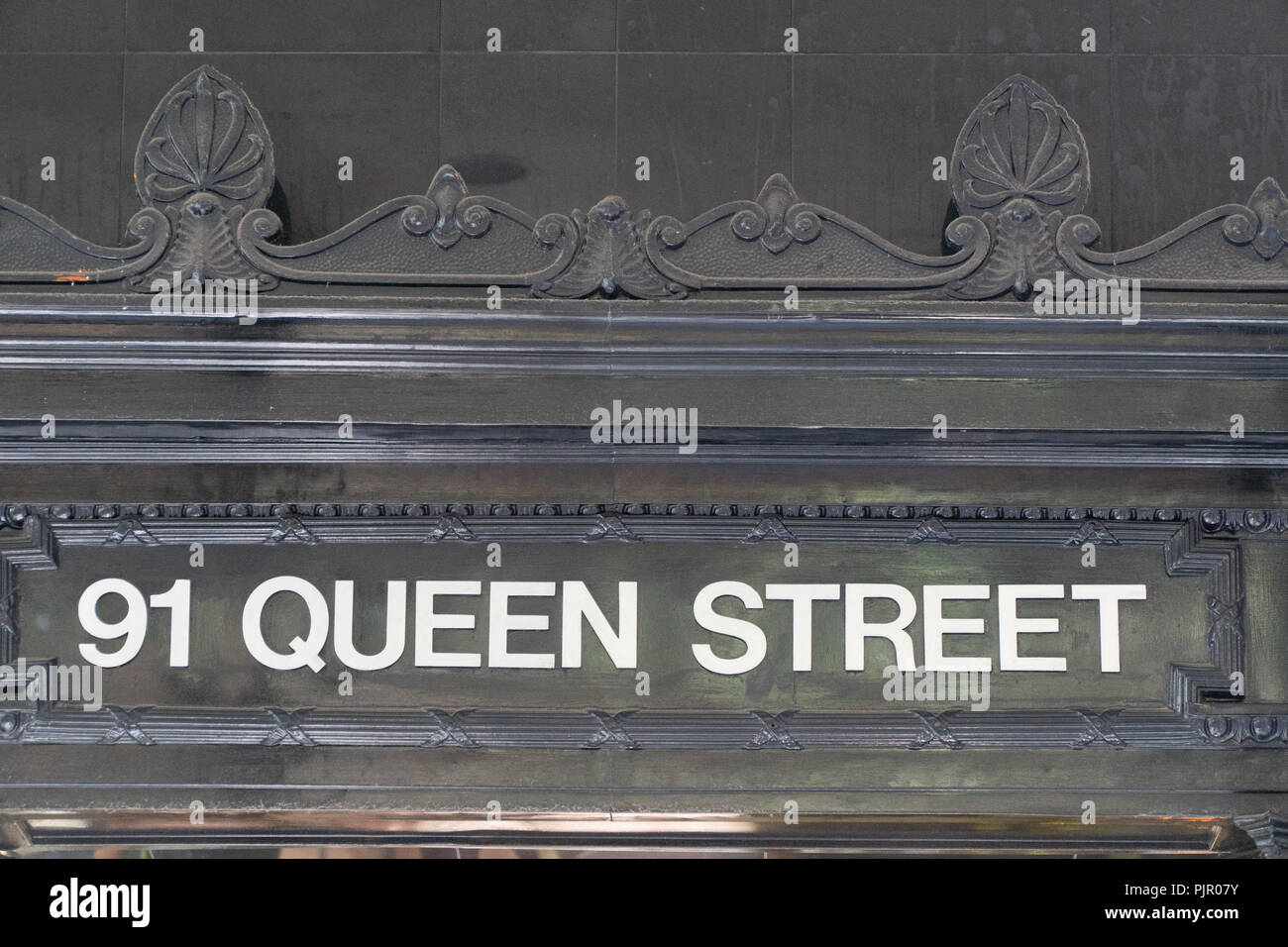 91 Queen Street font in entrance area Stock Photo