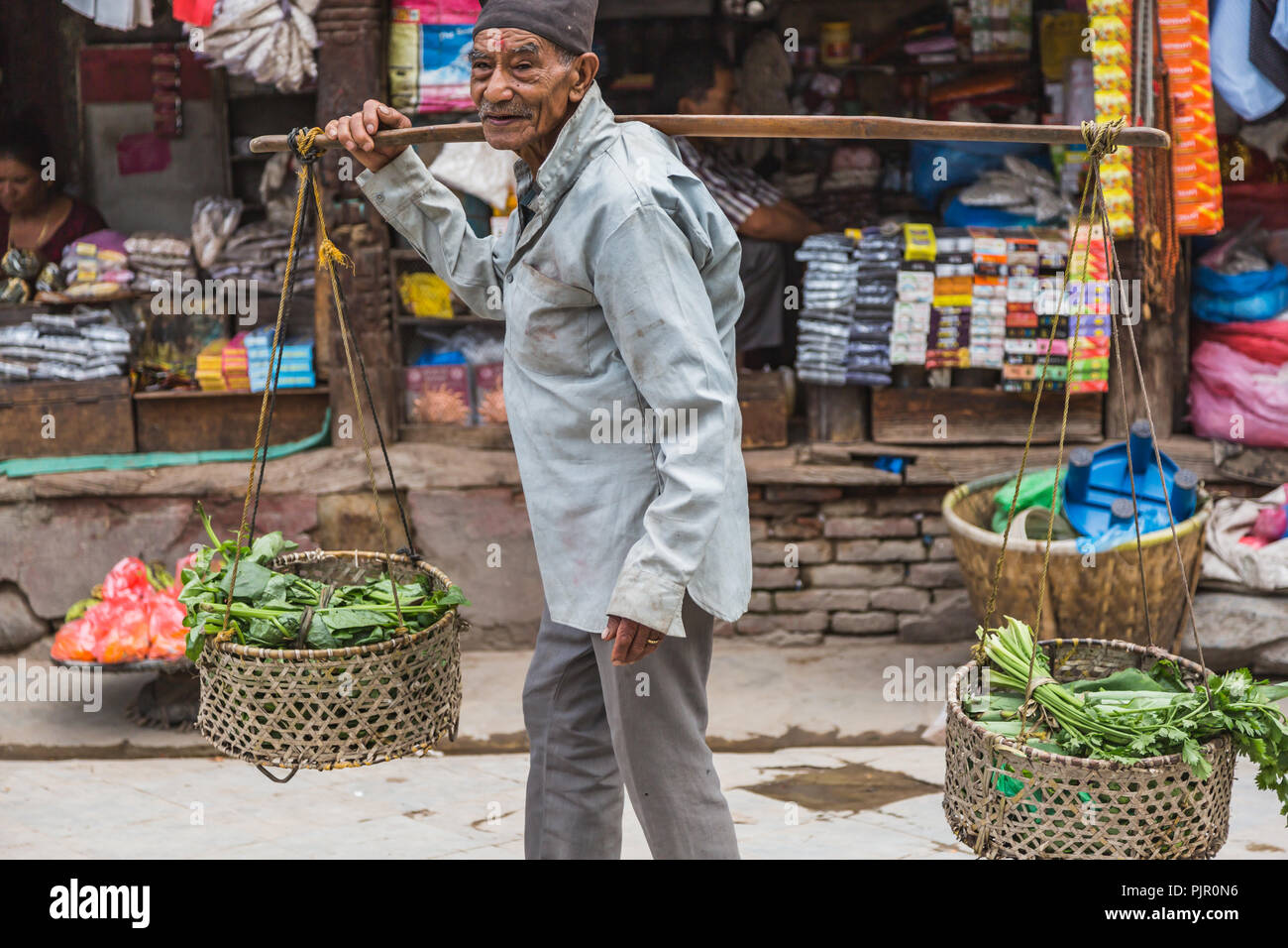 Kathmandu,Nepal Jul 22,2018An old man selling vegetables in a
