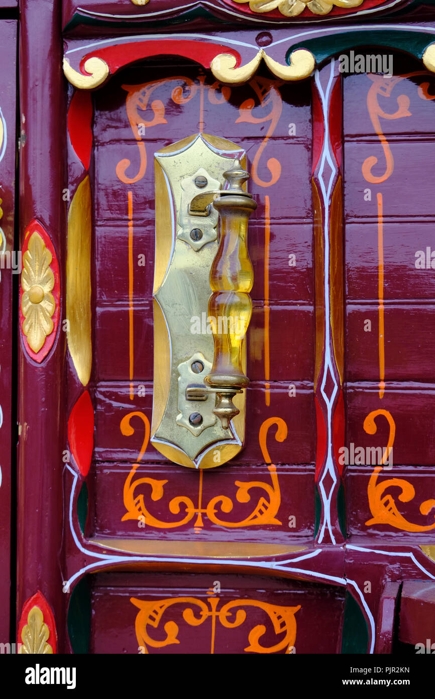 Close up of amber handle on front of traditional,antique gypsy caravan built by Thomas Tong of Kearsley in the 19th century Stock Photo
