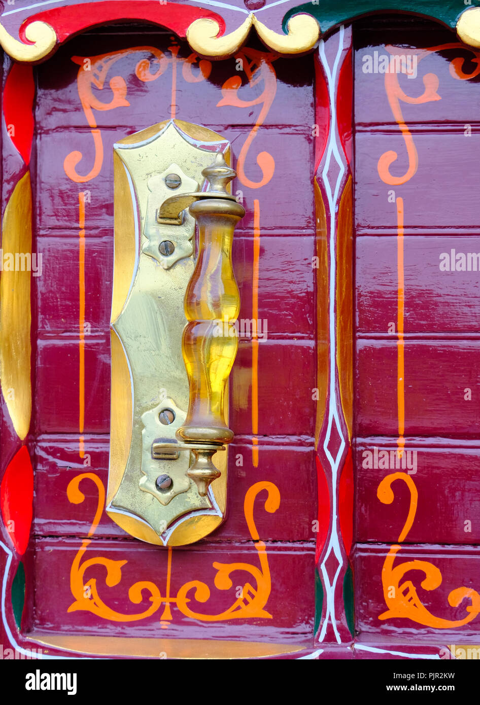 Close up of amber handle on front of traditional,antique gypsy caravan built by Thomas Tong of Kearsley in the 19th century Stock Photo