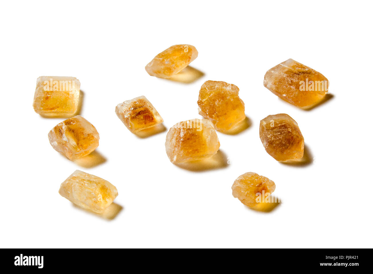 Some isolated crystals of brown sugar Stock Photo Alamy