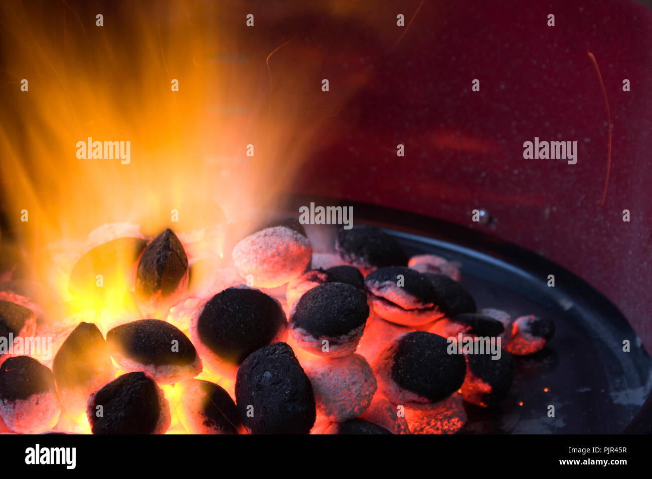 Burning charcoal in a grill Stock Photo Alamy