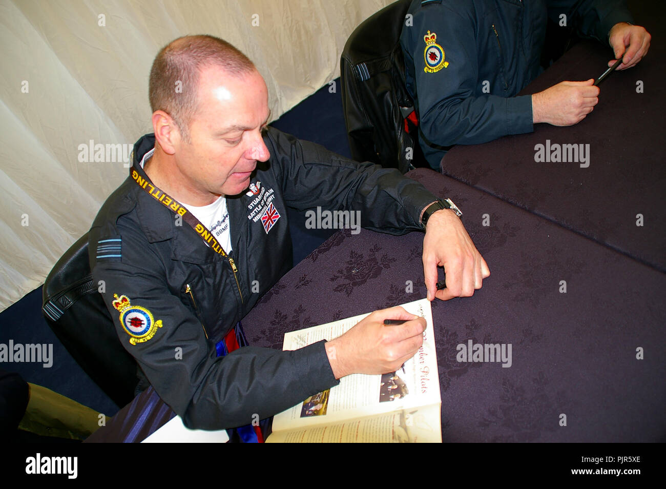 RAF Battle of Britain Memorial Flight Lancaster pilot Squadron Leader Stuart Reid at a signing event Stock Photo