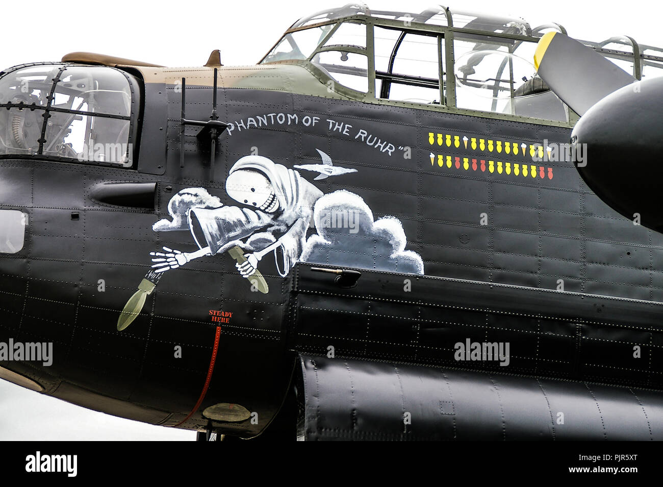 Royal Air Force, RAF Battle of Britain Memorial Flight Avro Lancaster with Phantom of the Ruhr nose art and bombing mission markings. Ghost, bombs Stock Photo