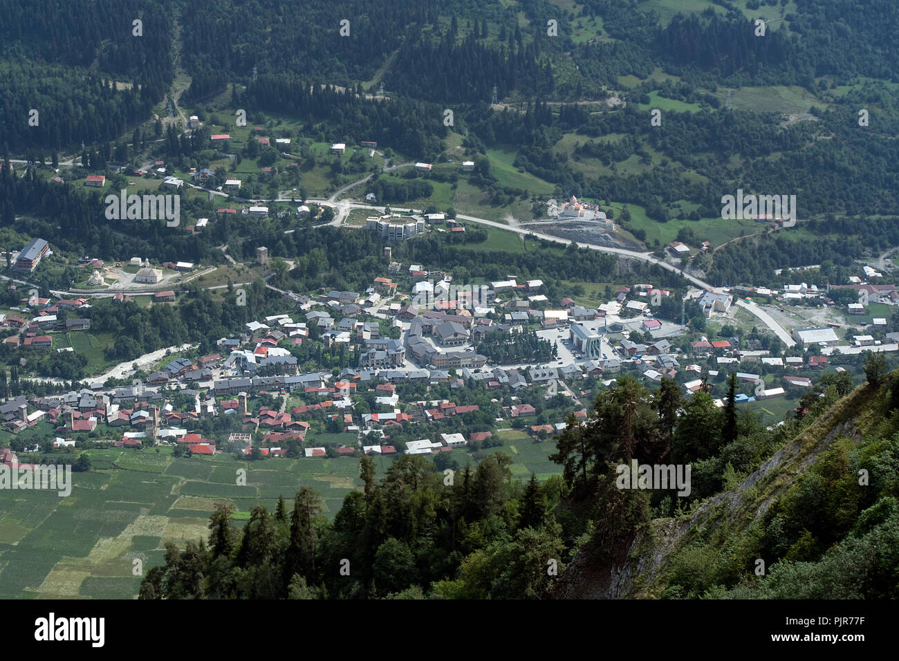 High up view of the tourist destination mountain village of Mestia, in the Savanti Region, Georgia. Famous for the surrounding Caucasus Mountains. Stock Photo