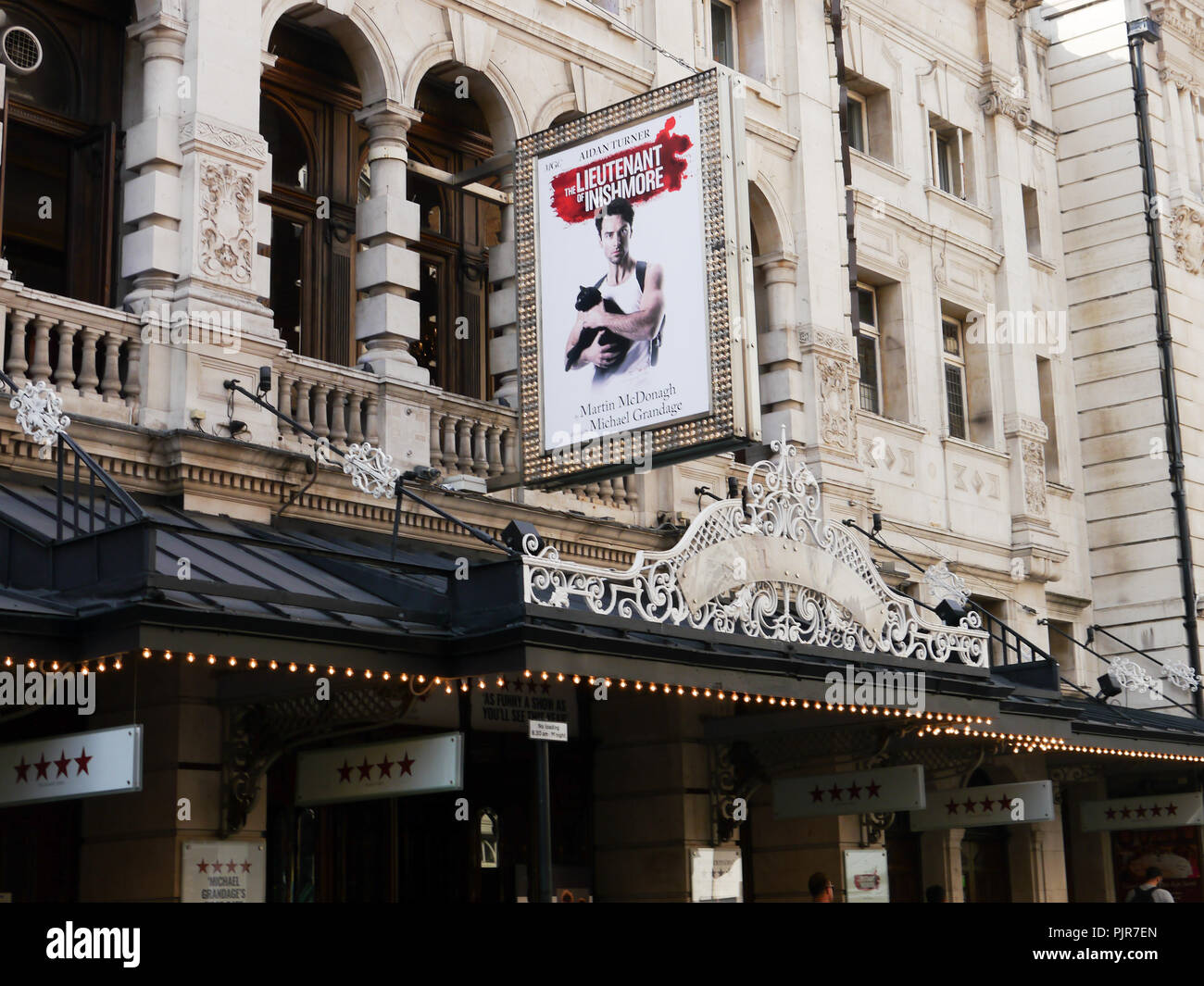 The Noel Coward theatre in London's West end with signage for the play 'The leiutenant of Inishmore' starring Aidan Turner Stock Photo