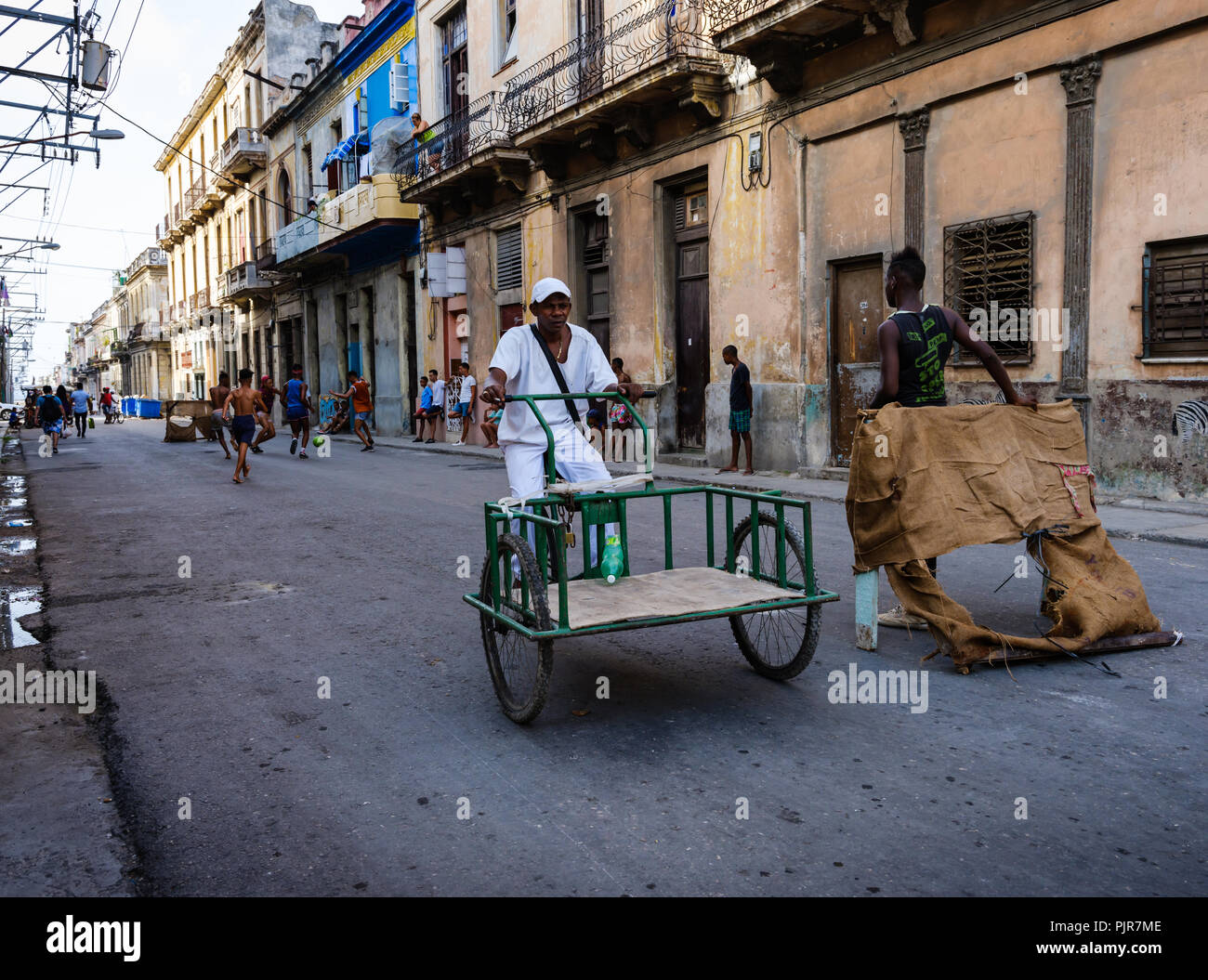 HAVANA, CUBA - CIRCA MAY 2017:  Boys playing soccer in the streets of  Havana. This is very typical around town. Stock Photo