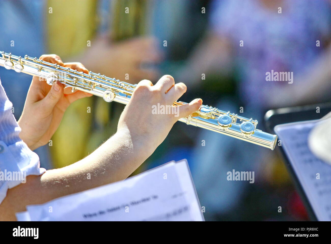Flute music playing flutist musician performer with bright instrument
