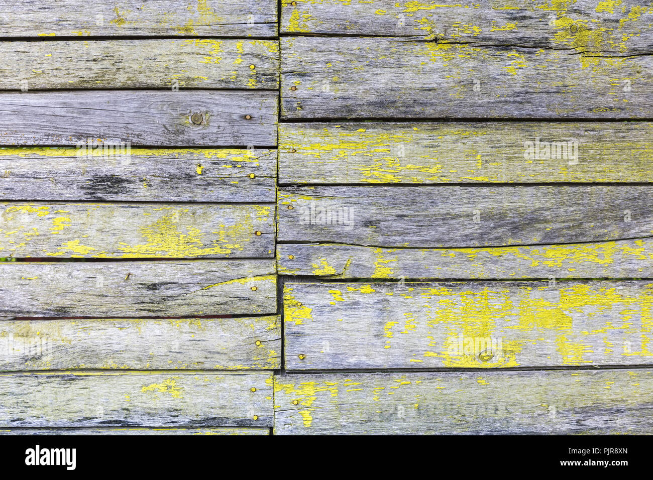 yellow peeling paint wooden wall textured background Stock Photo - Alamy