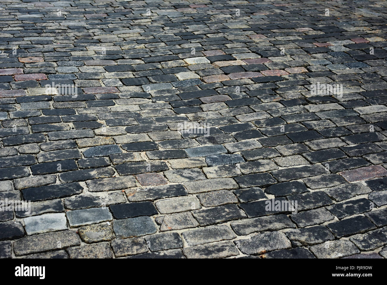 old cobblestone road for background or texture Stock Photo - Alamy