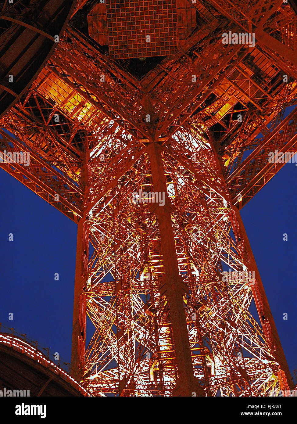 Eiffel Tower detail illuminated at night: the second level and the south-east pillar Stock Photo