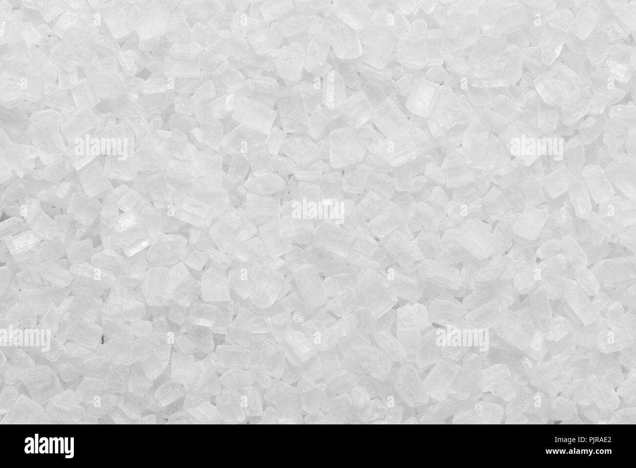 white granulated sugar texture or salt granule background Stock Photo