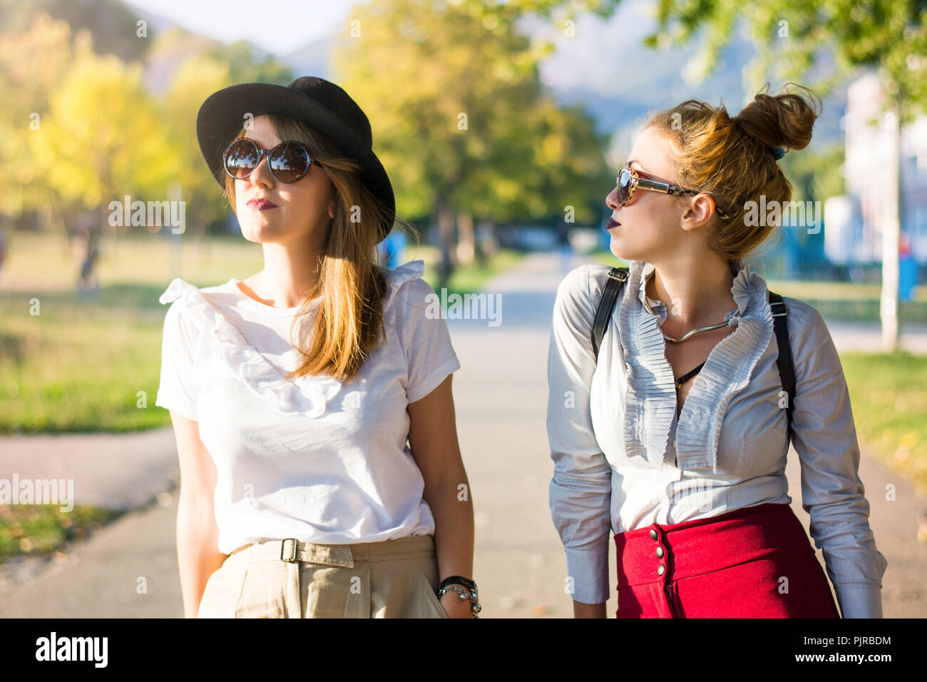 Girls standing in park hi-res stock photography and images - Alamy