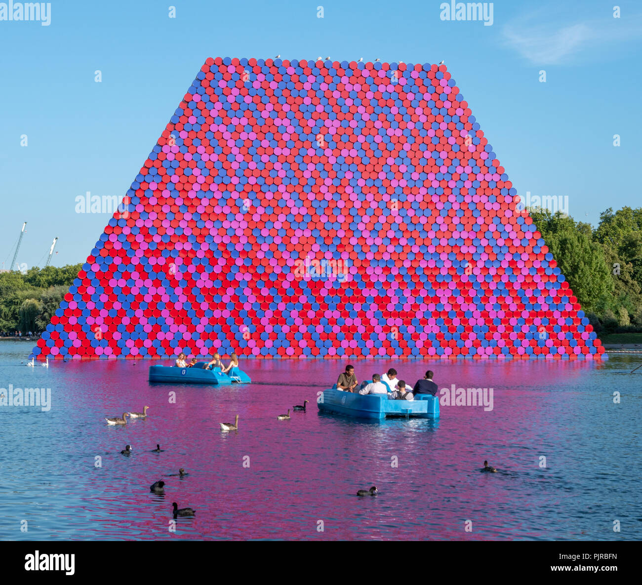 ‘The London Mastaba’ a gigantic sculpture made from coloured oil barrels  in the serpentine in Hyde Park London by Bulgarian artist Christo Stock Photo