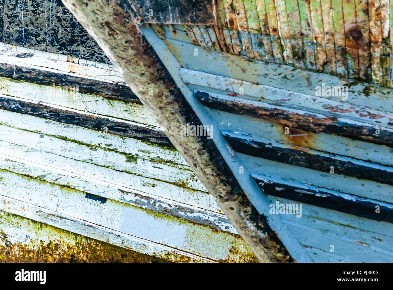 Close up on the hulls of fishing boats anchored in the port of Essaouira in Morocco Stock Photo