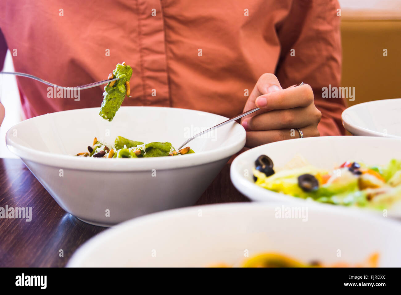 Female eating pasta in the restaurant close up Stock Photo