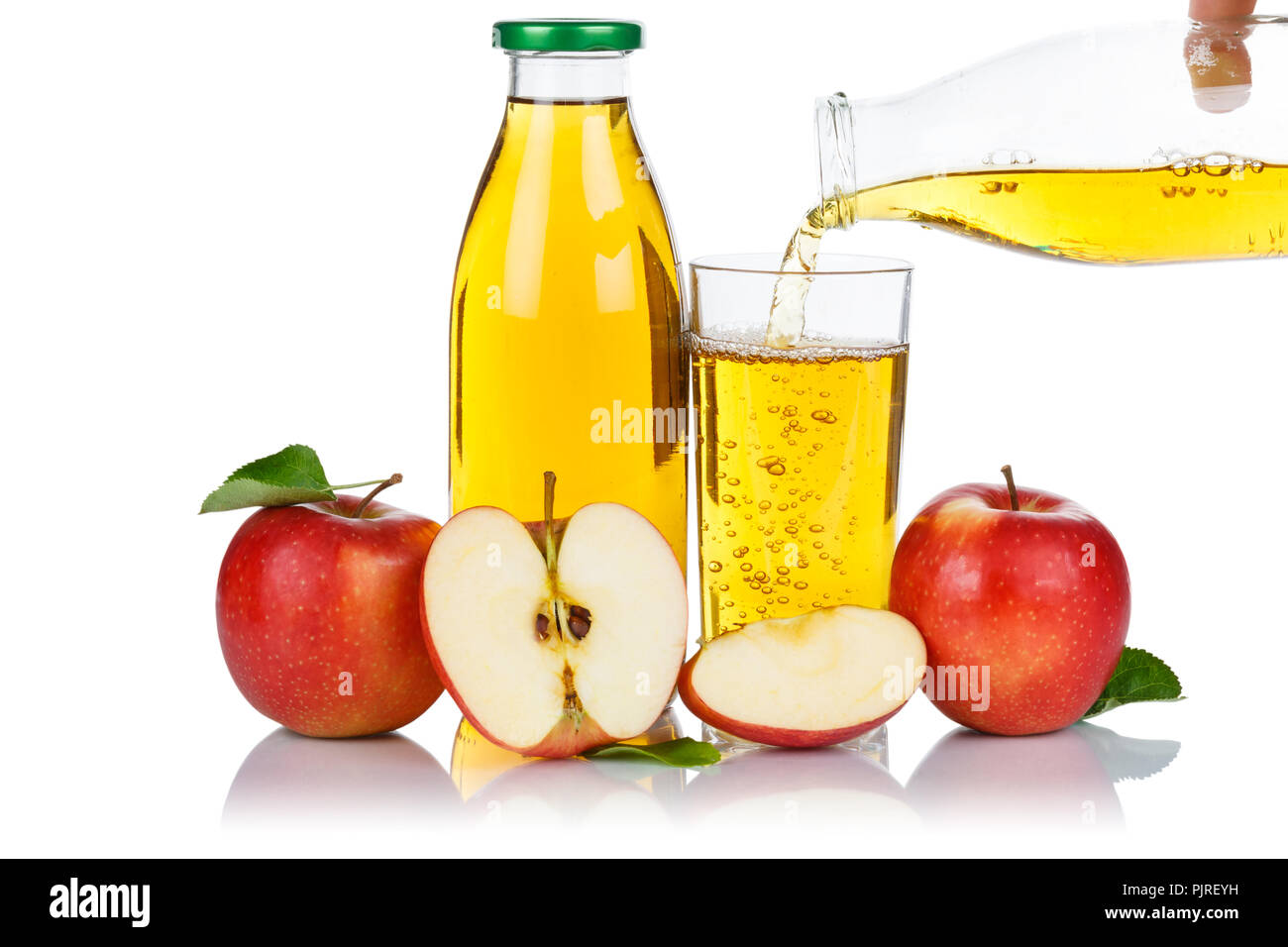 Apple juice pouring pour apples fruit fruits bottle isolated on a white background Stock Photo