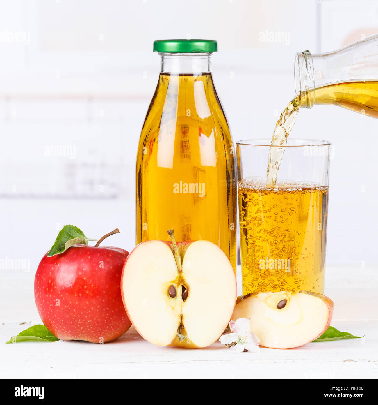 Apple juice pouring pour apples fruit fruits bottle square squared Stock Photo