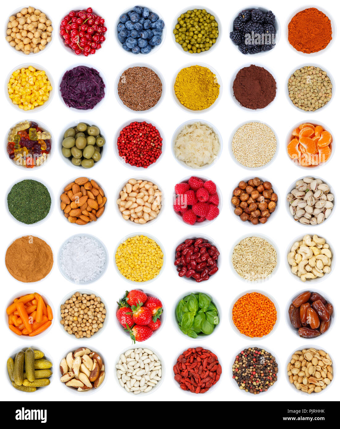 Fruits and vegetables berries spices herbs from above portrait format isolated on a white background Stock Photo