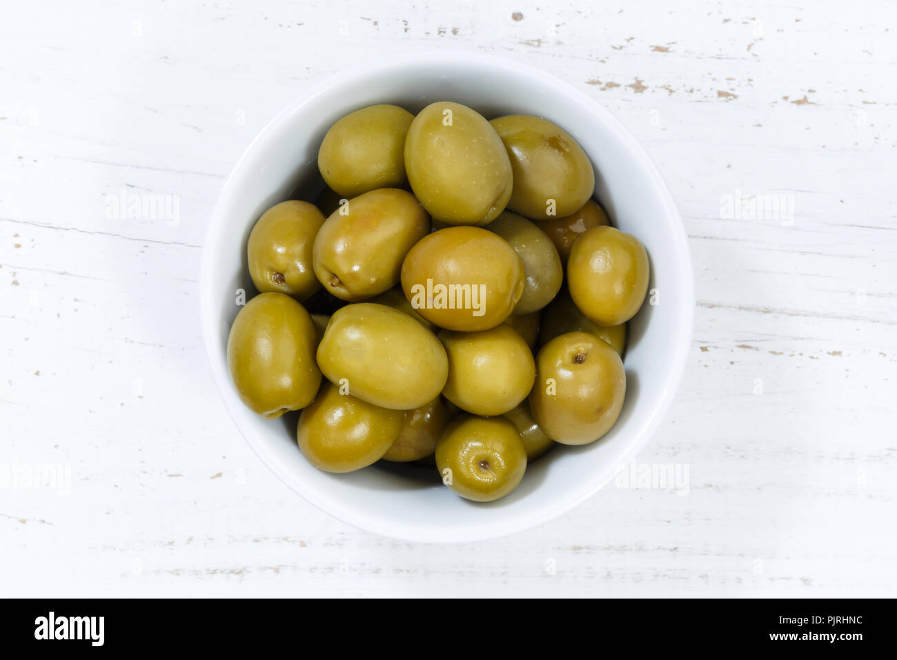 Olives green olive from above bowl wooden board wood Stock Photo