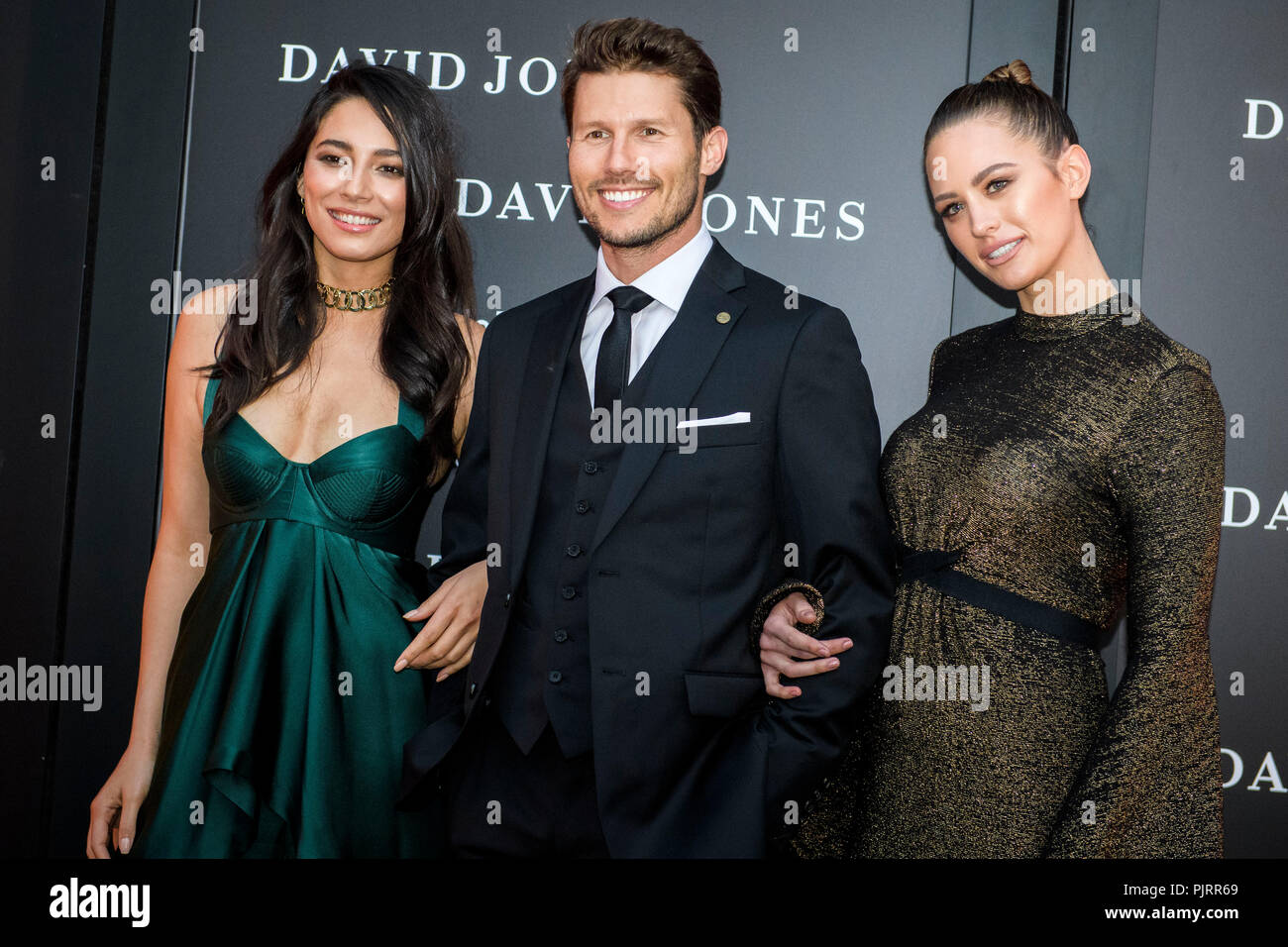 David Jones Ambassadors (L-R) Jessica Gomes, Jason Dundas and Jesinta Campbell poses for photographs during celebrations for the opening of  a new signature ‘boutique’ store in Barangaroo South on November 2, 2016 in Sydney, Australia.   (Photo by Hugh Peterswald) Stock Photo