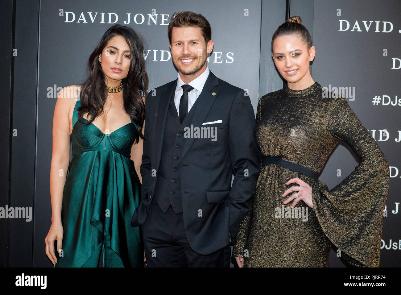 David Jones Ambassadors (L-R) Jessica Gomes, Jason Dundas and Jesinta Campbell poses for photographs during celebrations for the opening of  a new signature ‘boutique’ store in Barangaroo South on November 2, 2016 in Sydney, Australia.   (Photo by Hugh Peterswald) Stock Photo