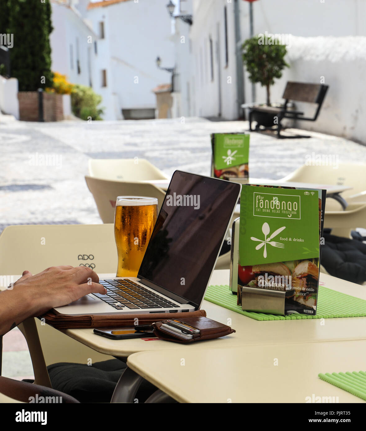 Laptop work at a Spanish bar Stock Photo Alamy