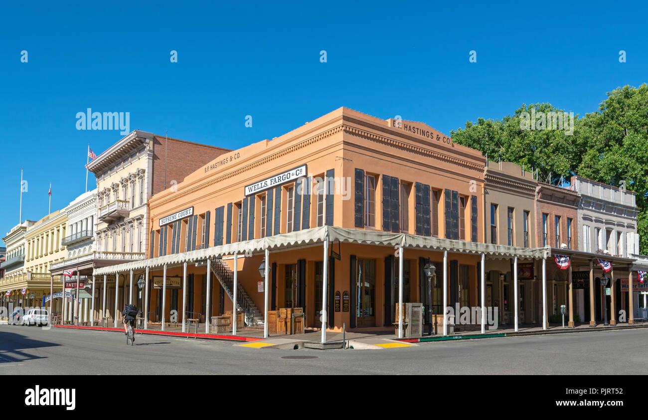 California, Old Sacramento, 2nd Street, historic buildings, bicyclist Stock Photo