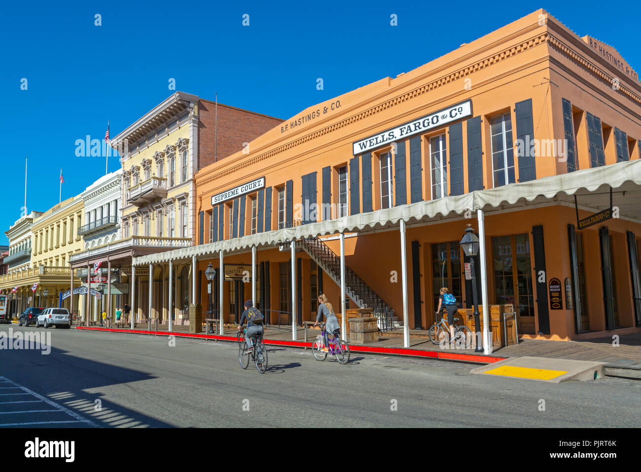 California, Old Sacramento, 2nd Street, historic buildings, bicyclists Stock Photo