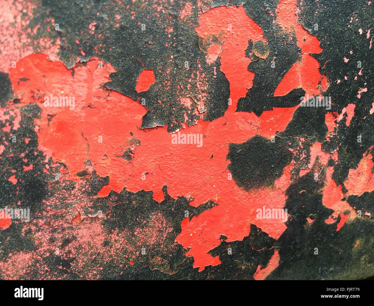 Red and Black Peeling Paint Stock Photo