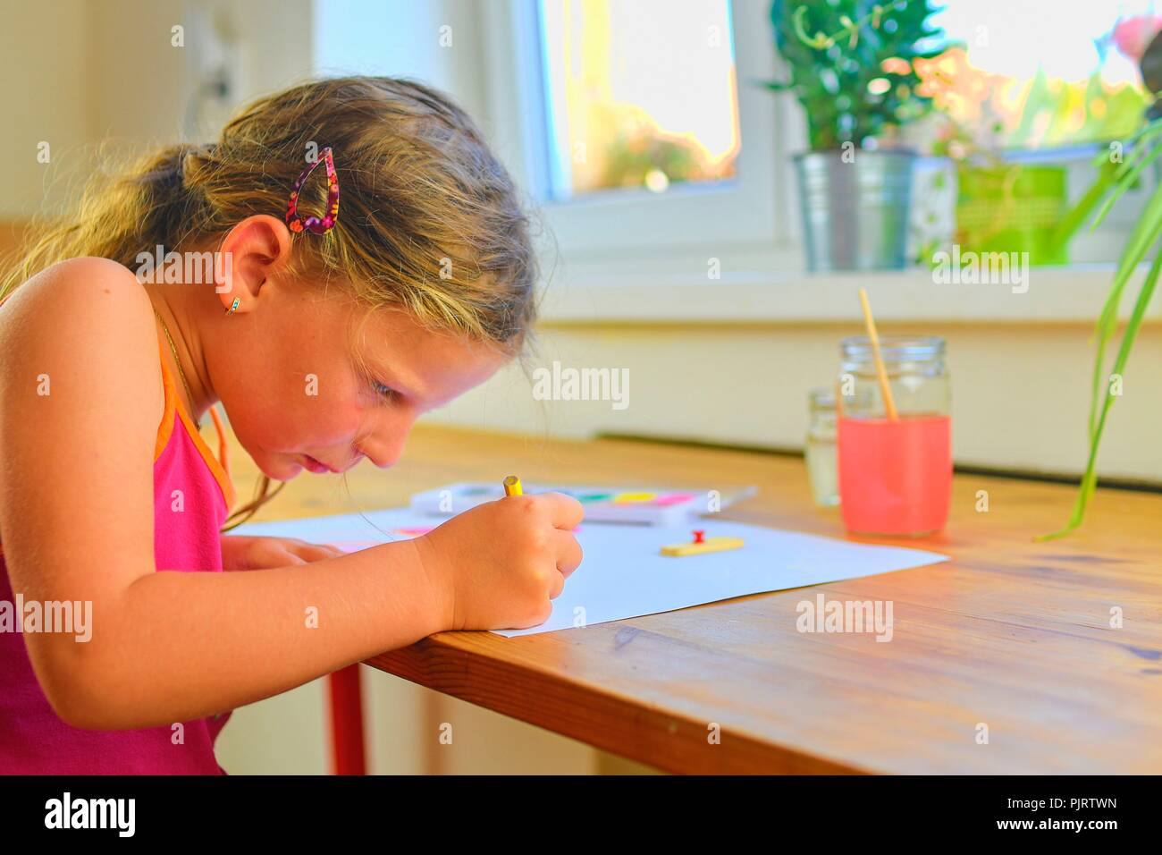 Little girl painting simple picture. Cute girl painting with ...