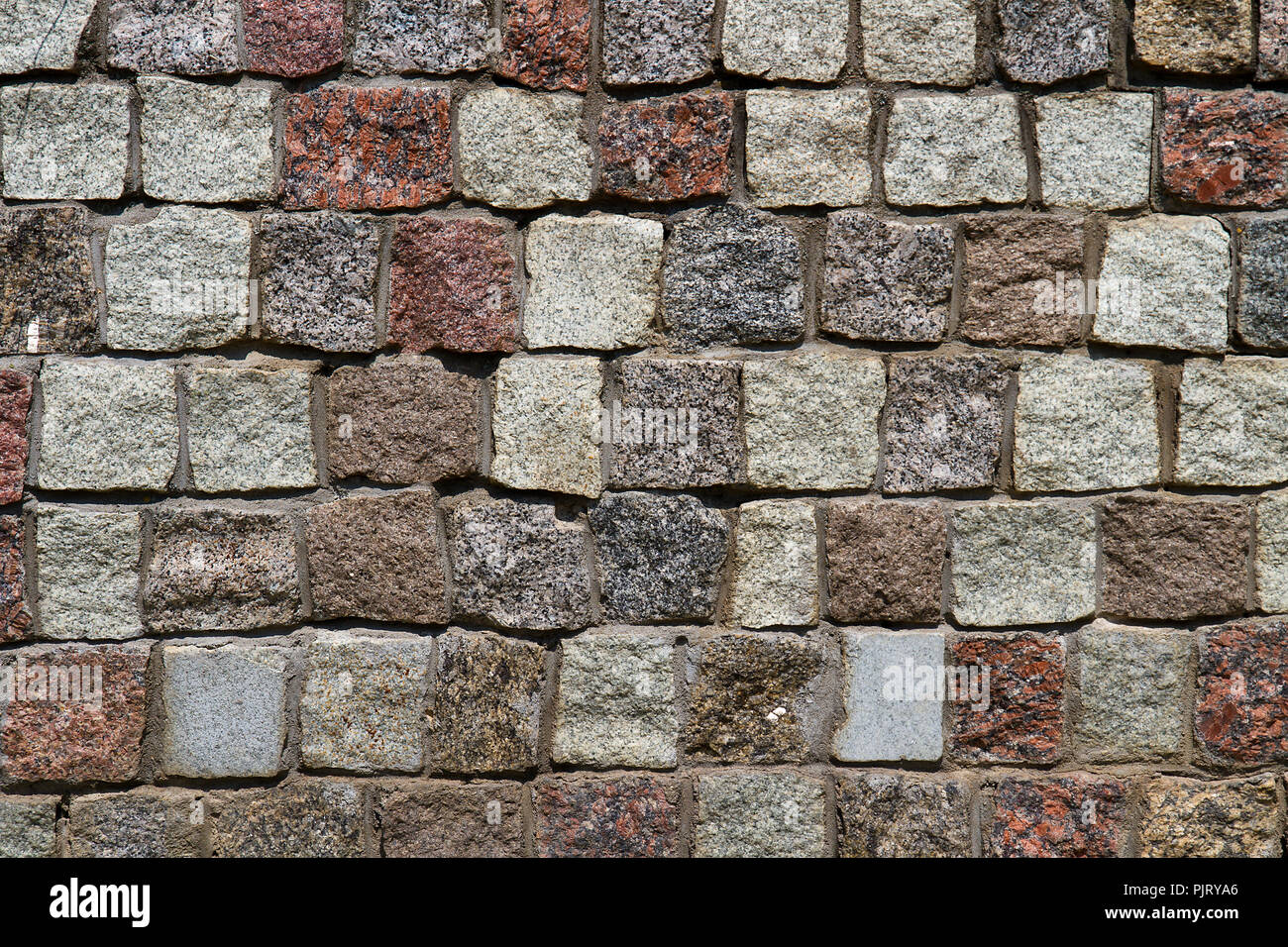 Granite brickwall texture pattern close-up shot. Background image. Stock Photo