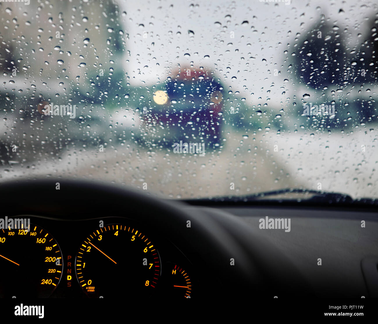 dashboard and rain droplets on car windshield Stock Photo Alamy