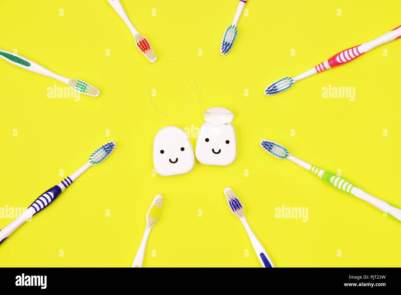Toothbrushes and dental floss on yellow background,top view Stock Photo ...