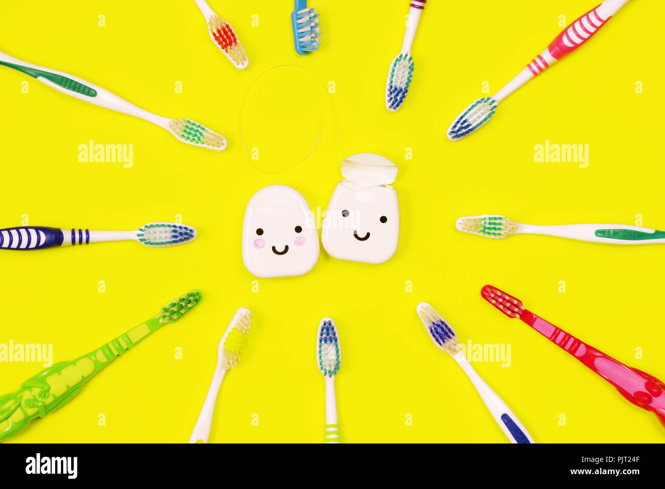 Toothbrushes and dental floss on yellow background,top view Stock Photo ...