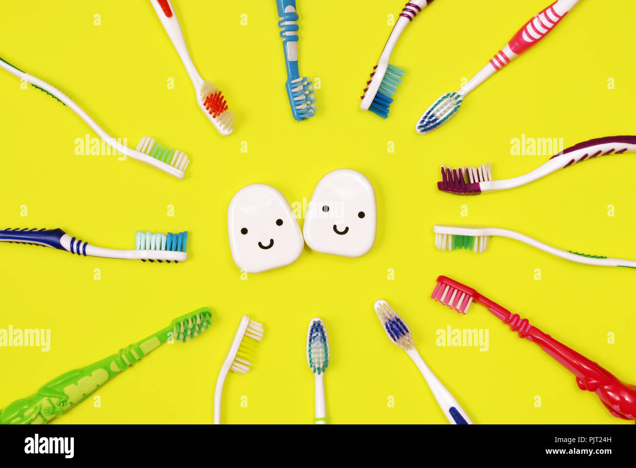 Toothbrushes and dental floss on yellow background,top view Stock Photo ...