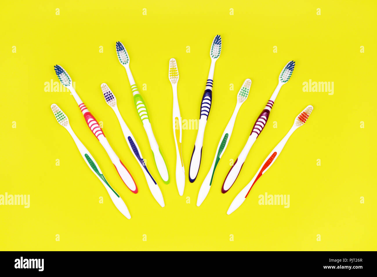 Toothbrushes on yellow background, teeth cleaning concept Stock Photo ...