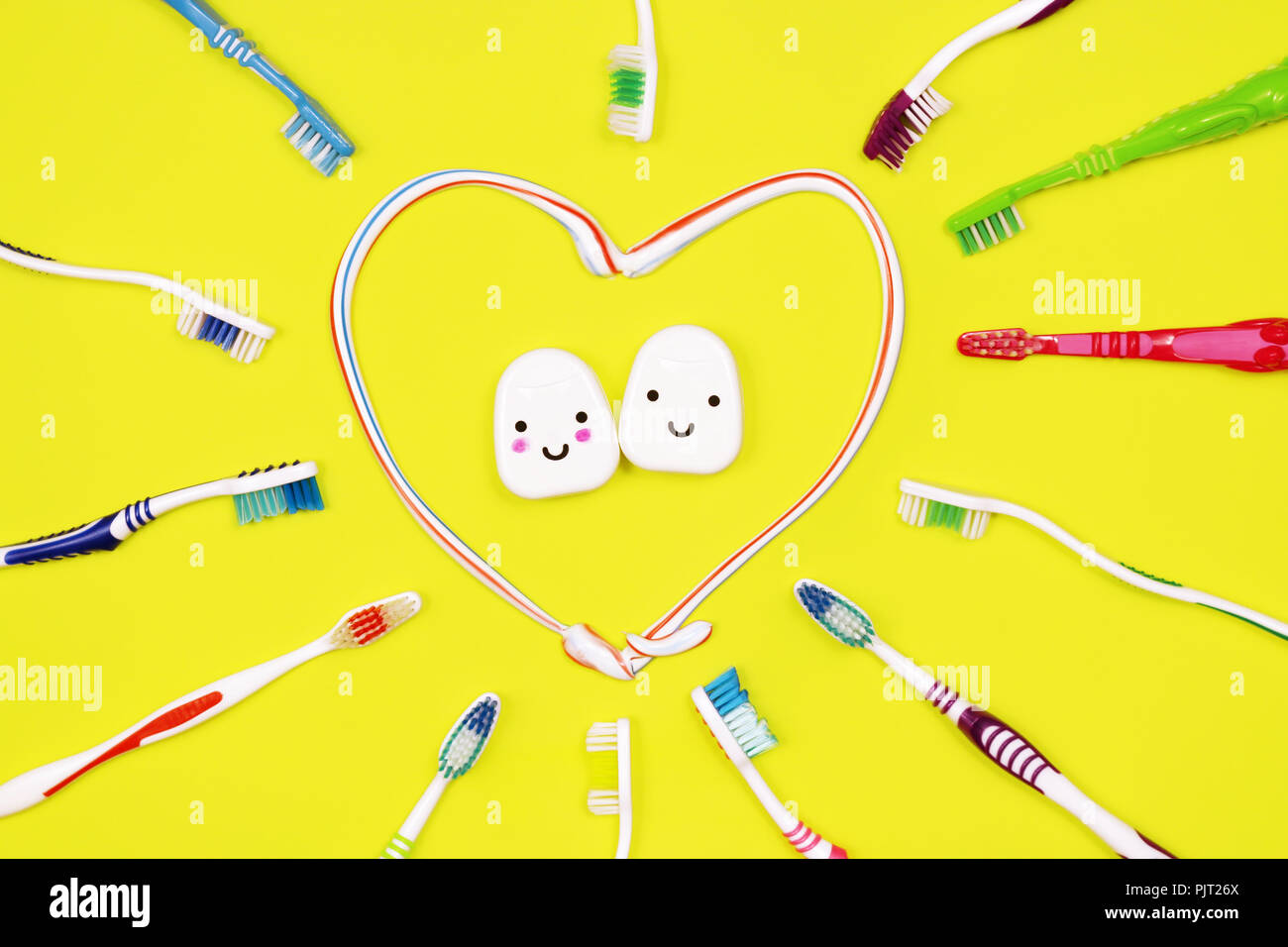 Toothbrushes and dental floss on yellow background,top view Stock Photo ...
